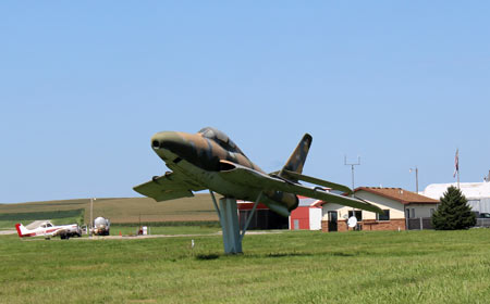 Picture of an old fighter jet at the Harlan Municipal Airport